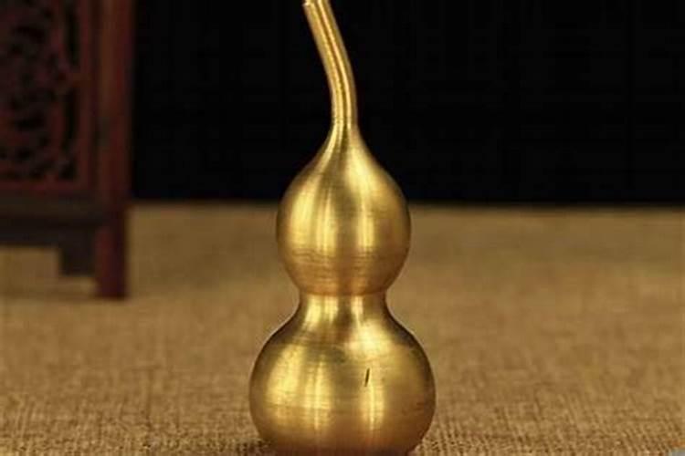 大门挂白玉葫芦好还是挑木葫芦、天然葫芦好？